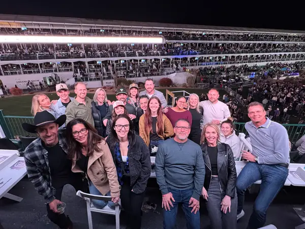 Encore team and guests gathered in the arena stands at the Concert in the Coliseum