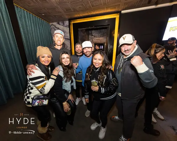 Encore team and clients posing together at a Vegas Golden Knights game