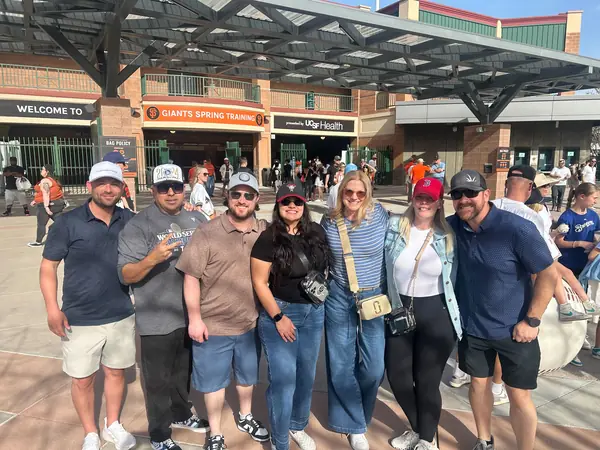 Encore team and guests outside the ballpark at a Giants spring training game