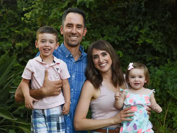 Partner Mike DiFabbio with his wife and two young children outdoors