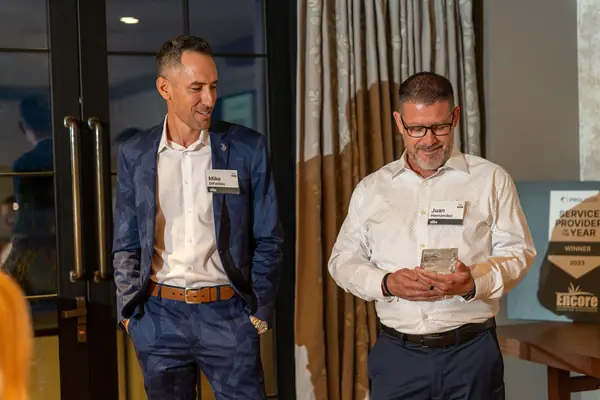 Two Encore leaders smiling at the Prologis Vendor of the Year event