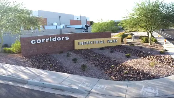 Corridors Industrial Park entry monument with a newly planted rock and shrub bed